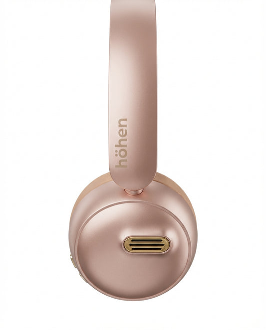 Detalle del audífono höhen Aura Mini en color rosa metalizado con diseño minimalista