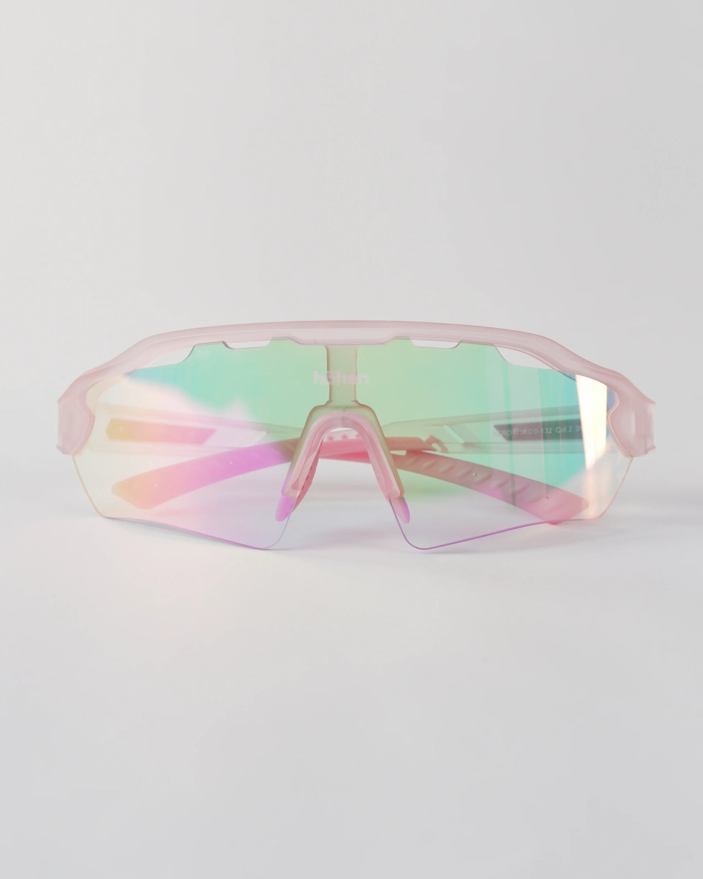 Front view of höhen aero women's sports sunglasses with a pink iridescent shield lens and matching frosted pink frame