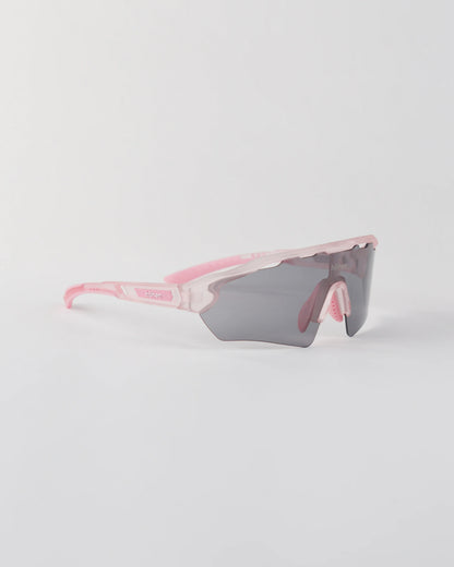 Three-quarter angle of the pink höhen aero sunglasses with a smoke-colored shield lens and ventilated frame top