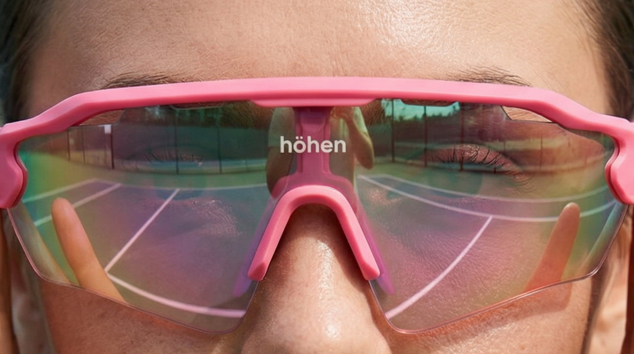 Close-up of höhen aero performance sunglasses with mirrored lenses, highlighting precision design, protection, and luxury sports aesthetics.