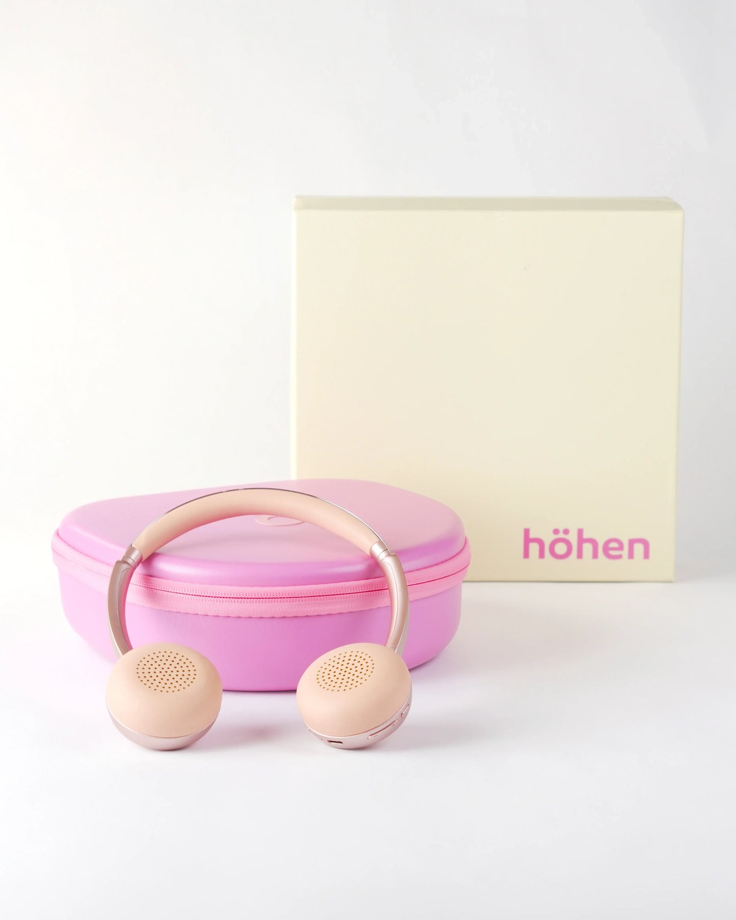Complete set of the höhen aura mini headphones including the pink travel case and the premium branded cream and pink packaging box