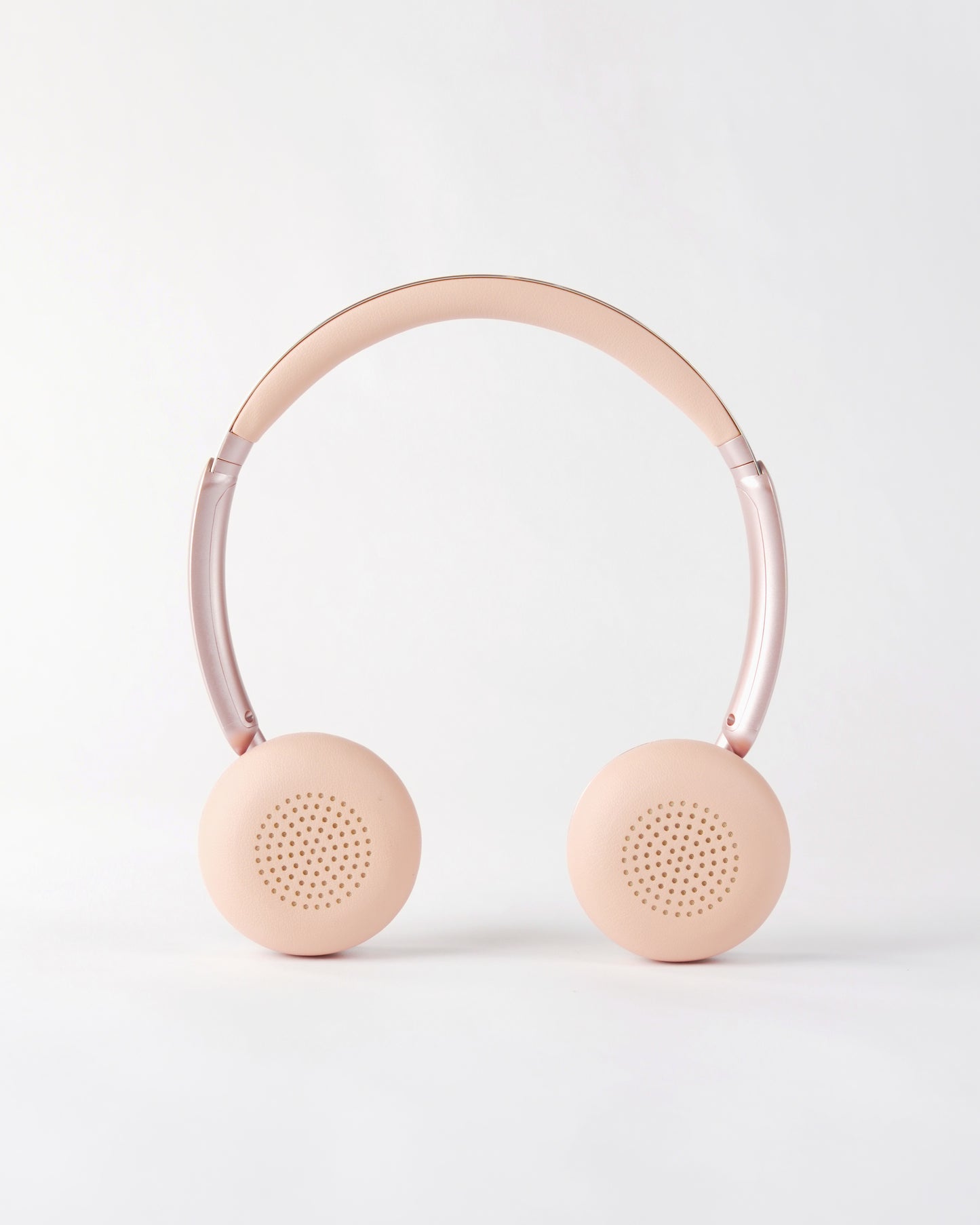 Frontal view of the höhen aura mini headphones in pink, showing the soft cushioned ear pads and adjustable headband