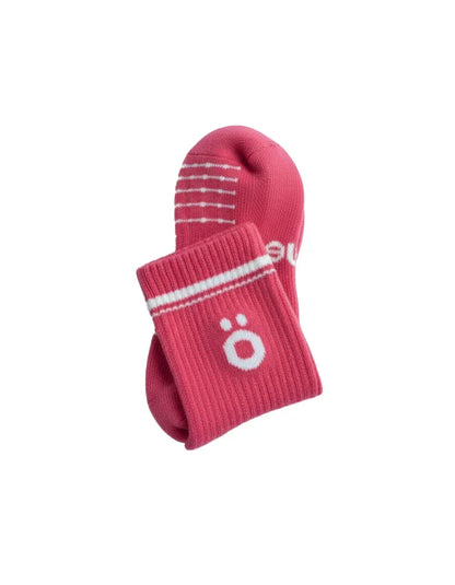Detail of magenta höhen merino socks with logo and ribbed finish, soft and durable for active use