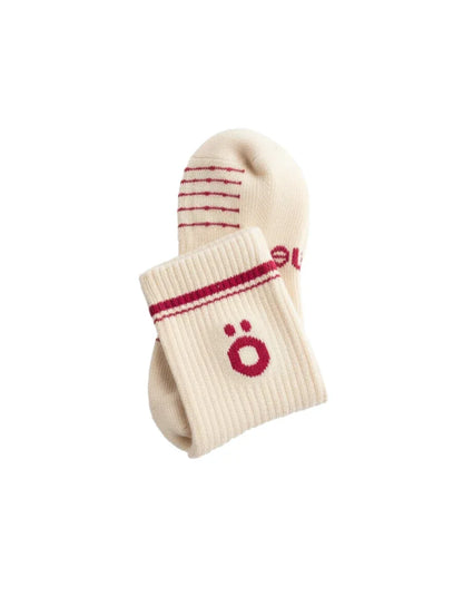 Detail of white höhen merino socks with logo and ribbed finish, soft and durable for active use